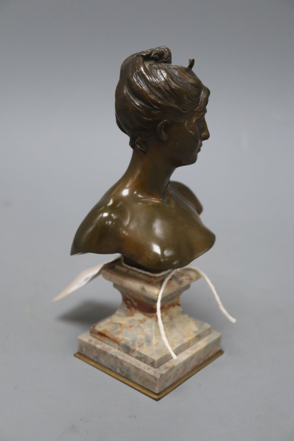 After Moreau. A bronze bust of a young lady, signed, height 19cm